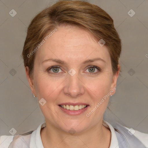 Joyful white adult female with short  brown hair and grey eyes