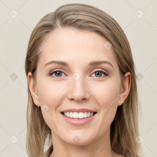 Joyful white young-adult female with long  brown hair and grey eyes