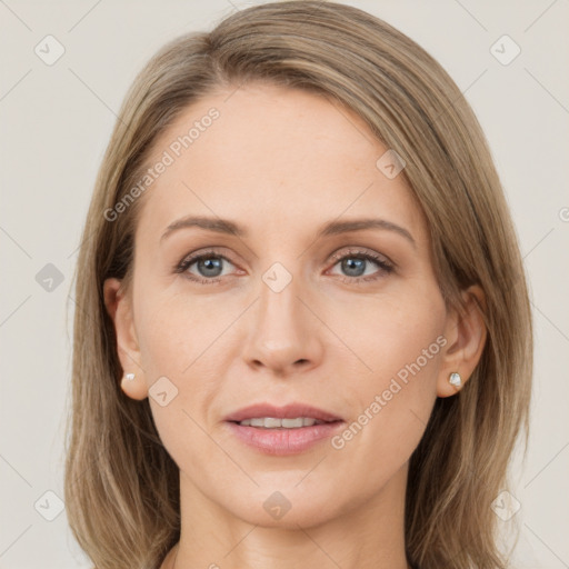 Joyful white adult female with medium  brown hair and grey eyes