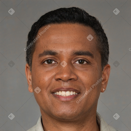 Joyful latino young-adult male with short  black hair and brown eyes