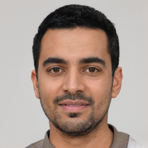 Neutral latino young-adult male with short  black hair and brown eyes