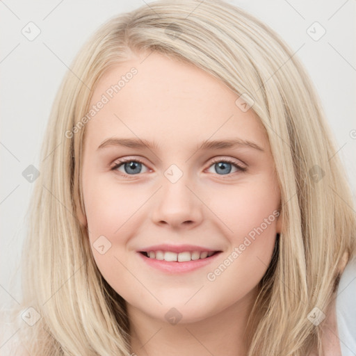 Joyful white young-adult female with long  brown hair and blue eyes