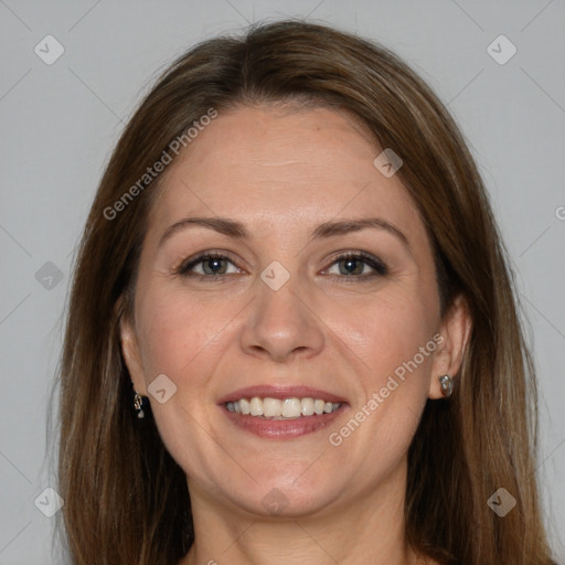 Joyful white adult female with long  brown hair and grey eyes