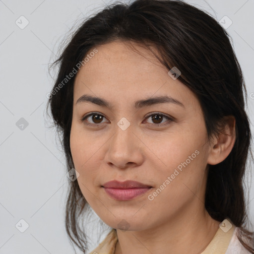 Joyful latino young-adult female with medium  brown hair and brown eyes