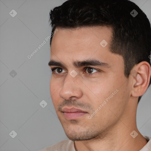 Joyful white young-adult male with short  black hair and brown eyes