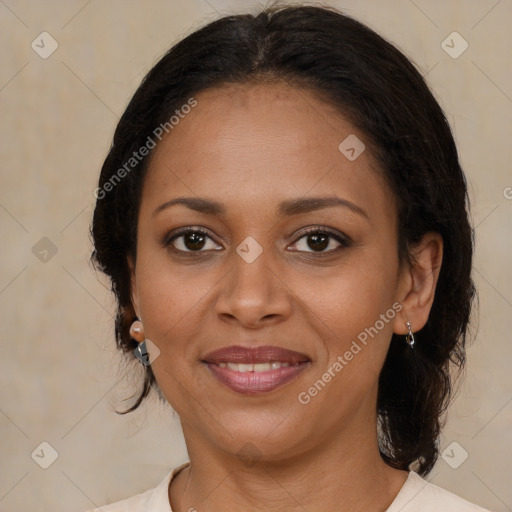 Joyful black young-adult female with medium  brown hair and brown eyes