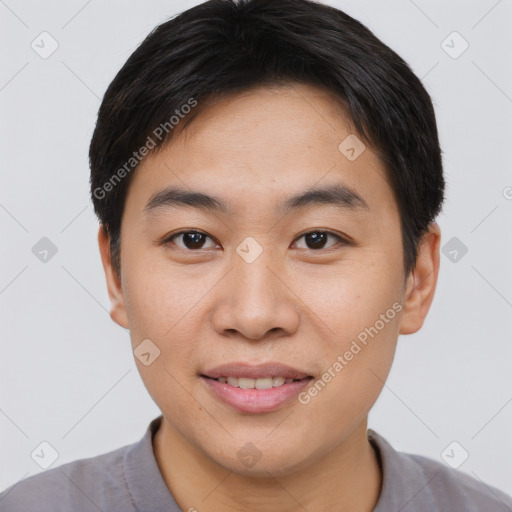 Joyful asian young-adult male with short  brown hair and brown eyes