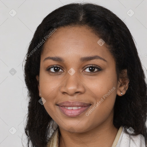 Joyful black young-adult female with long  black hair and brown eyes