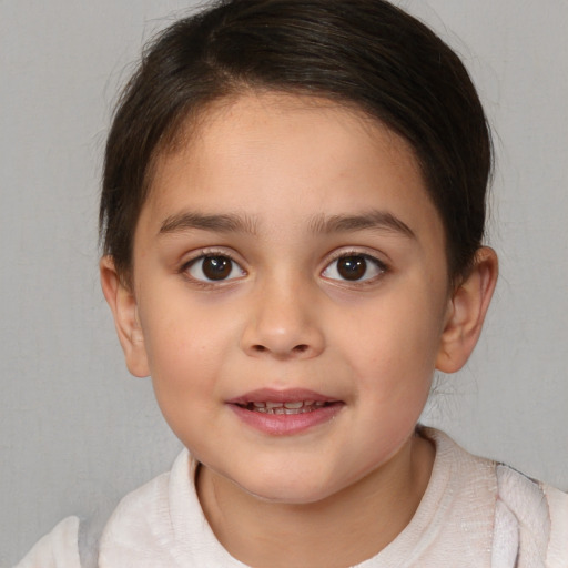 Joyful white child female with medium  brown hair and brown eyes