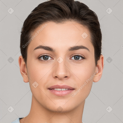 Joyful white young-adult female with short  brown hair and brown eyes