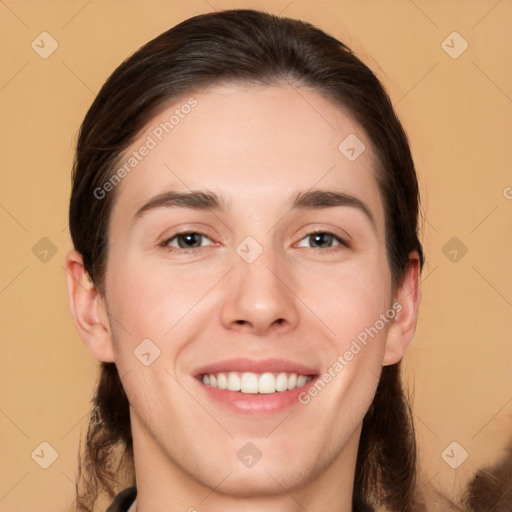 Joyful white young-adult female with long  brown hair and brown eyes