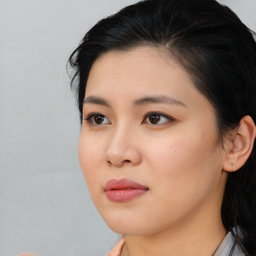 Neutral asian young-adult female with medium  black hair and brown eyes
