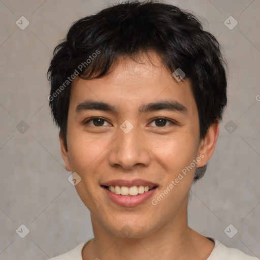 Joyful asian young-adult male with short  brown hair and brown eyes