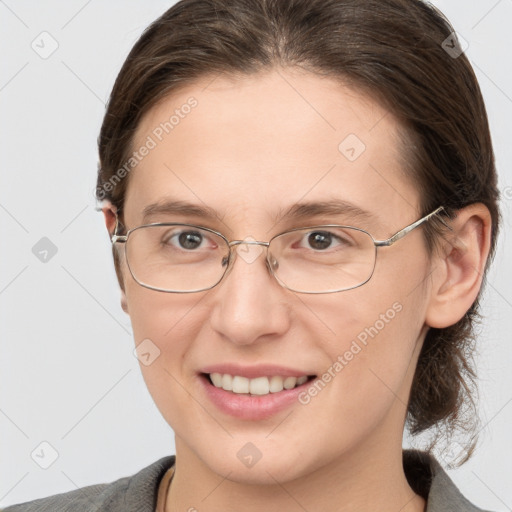 Joyful white adult female with medium  brown hair and grey eyes