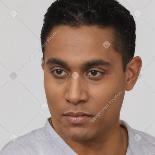 Neutral latino young-adult male with short  black hair and brown eyes