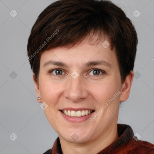 Joyful white young-adult female with short  brown hair and grey eyes