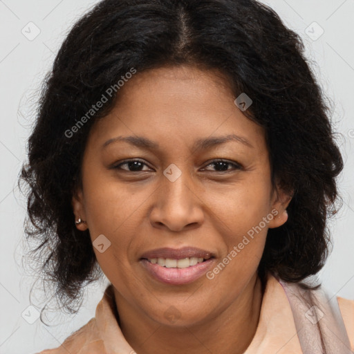 Joyful black adult female with long  brown hair and brown eyes