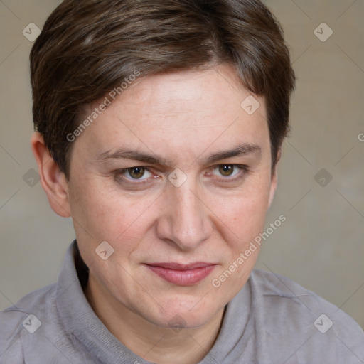 Joyful white adult female with short  brown hair and grey eyes