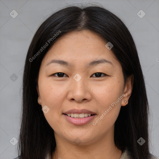 Joyful asian young-adult female with long  brown hair and brown eyes