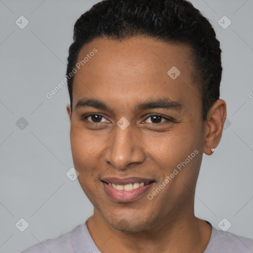 Joyful black young-adult male with short  black hair and brown eyes