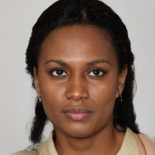 Neutral black young-adult female with medium  black hair and brown eyes