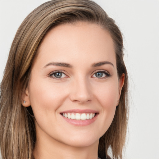 Joyful white young-adult female with long  brown hair and grey eyes