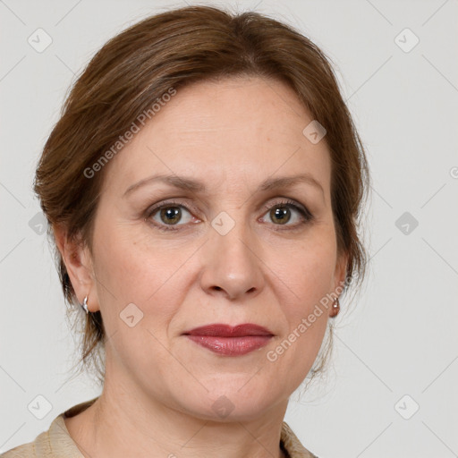 Joyful white adult female with medium  brown hair and grey eyes