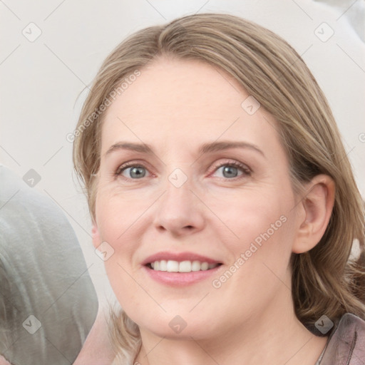 Joyful white young-adult female with medium  brown hair and blue eyes