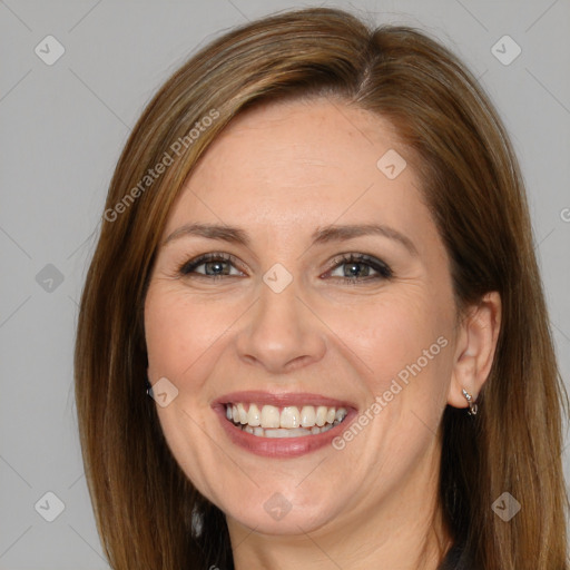 Joyful white adult female with long  brown hair and brown eyes