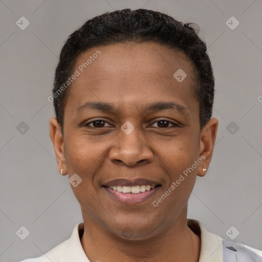 Joyful black young-adult female with short  brown hair and brown eyes