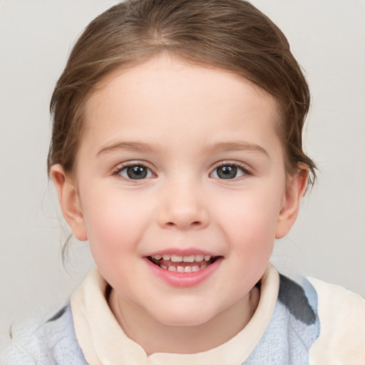 Joyful white child female with medium  brown hair and blue eyes