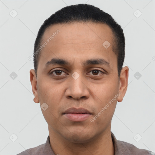 Neutral latino young-adult male with short  black hair and brown eyes