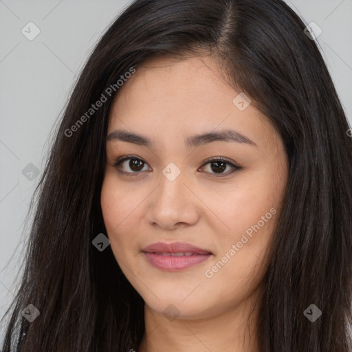 Joyful asian young-adult female with long  brown hair and brown eyes