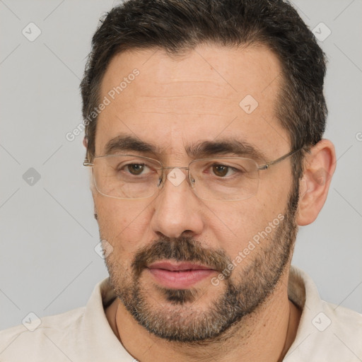 Neutral white adult male with short  brown hair and brown eyes