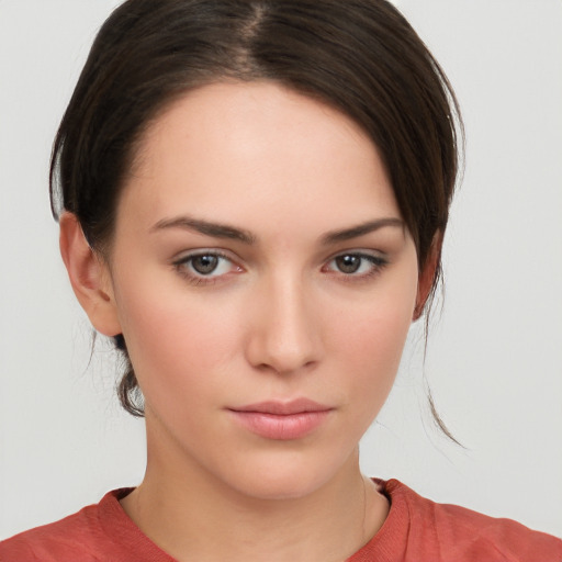 Neutral white young-adult female with medium  brown hair and brown eyes