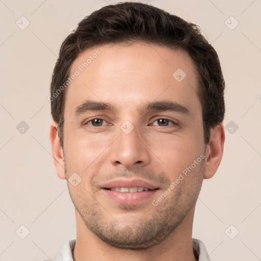 Joyful white young-adult male with short  brown hair and brown eyes