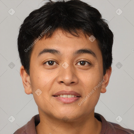 Joyful asian young-adult male with short  brown hair and brown eyes