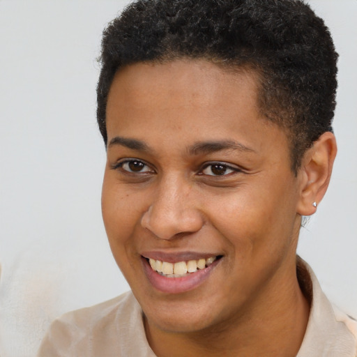 Joyful black young-adult male with short  brown hair and brown eyes
