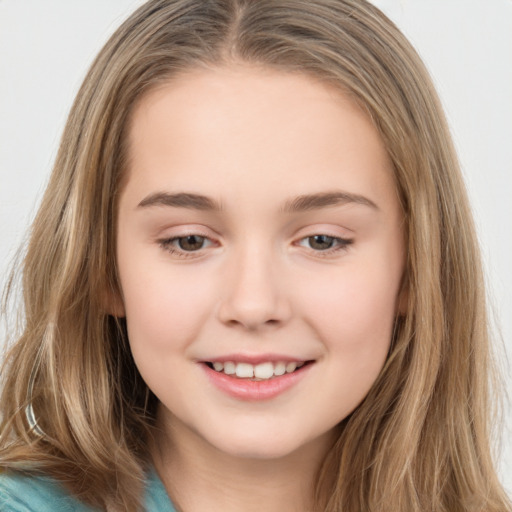 Joyful white child female with long  brown hair and brown eyes