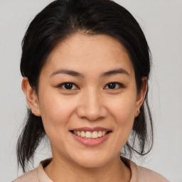 Joyful white young-adult female with medium  brown hair and brown eyes