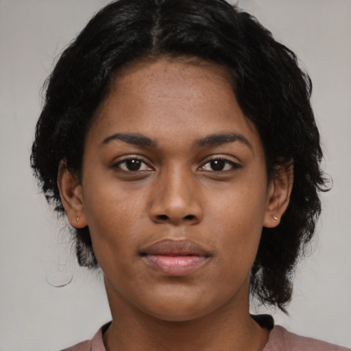 Neutral black young-adult female with medium  black hair and brown eyes