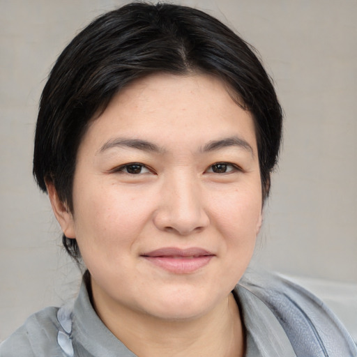 Joyful white young-adult female with medium  black hair and brown eyes