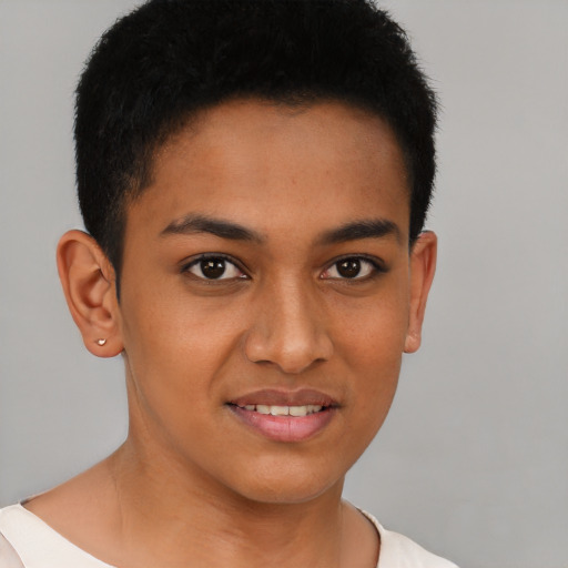 Joyful latino young-adult male with short  brown hair and brown eyes