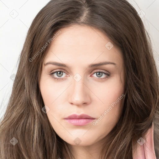 Neutral white young-adult female with long  brown hair and green eyes