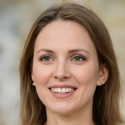 Joyful white young-adult female with long  brown hair and green eyes