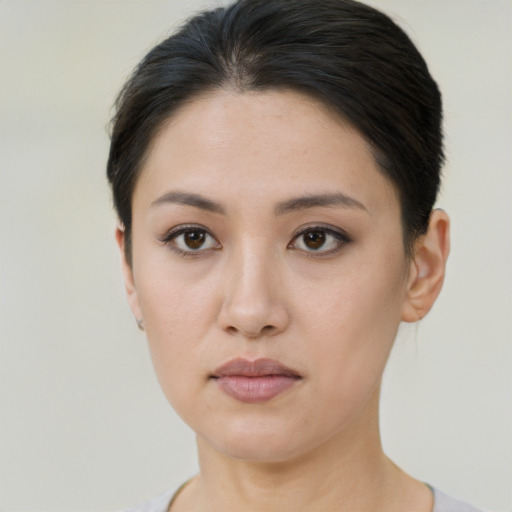 Neutral asian young-adult female with short  brown hair and brown eyes