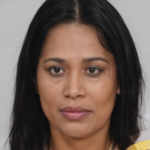 Joyful asian adult female with long  brown hair and brown eyes