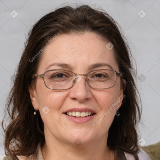 Joyful white adult female with medium  brown hair and grey eyes