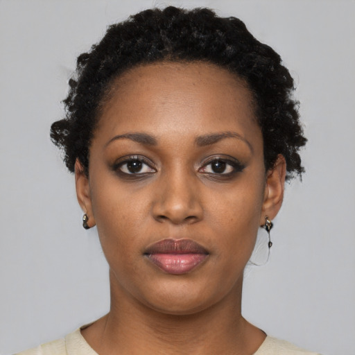 Neutral black young-adult female with short  black hair and brown eyes