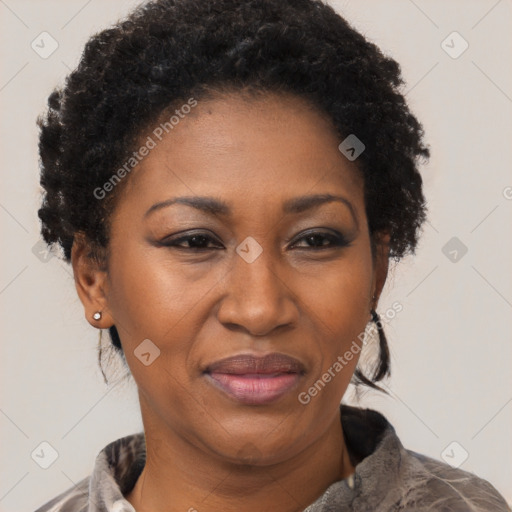 Joyful black adult female with short  brown hair and brown eyes